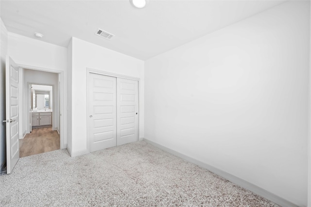 18005 Umberto Dr, Pflugerville, TX 78660 - unfurnished bedroom with carpet flooring and a closet