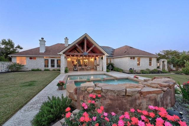 1310 Ventana Cyn, Leander, TX 78641 - view of swimming pool featuring a patio, an outdoor living space, and a pool with connected hot tub