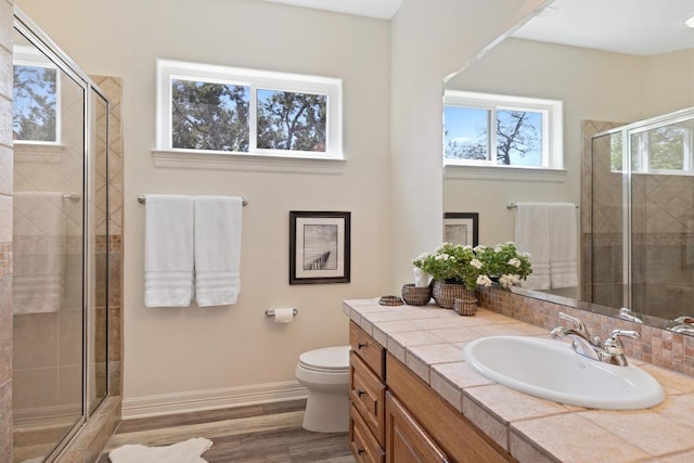 1310 Ventana Cyn, Leander, TX 78641 - full bath featuring vanity, a stall shower, and wood finished floors