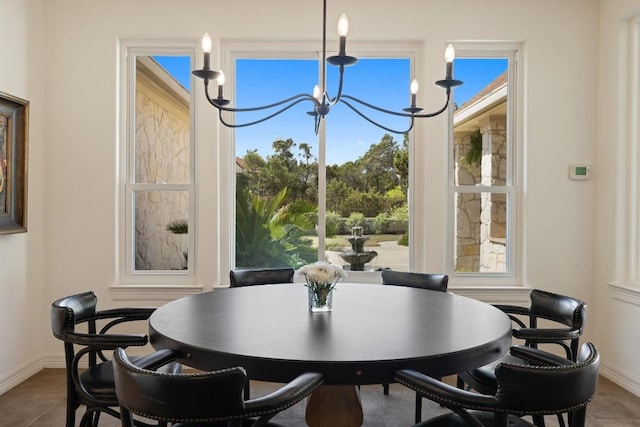 1310 Ventana Cyn, Leander, TX 78641 - dining room with a chandelier and baseboards
