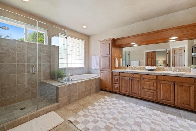 1310 Ventana Cyn, Leander, TX 78641 - full bath with plenty of natural light, double vanity, tile patterned floors, and recessed lighting
