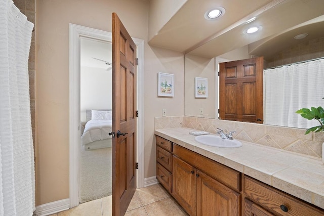1310 Ventana Cyn, Leander, TX 78641 - full bathroom with vanity, ensuite bathroom, tile patterned floors, tasteful backsplash, and recessed lighting
