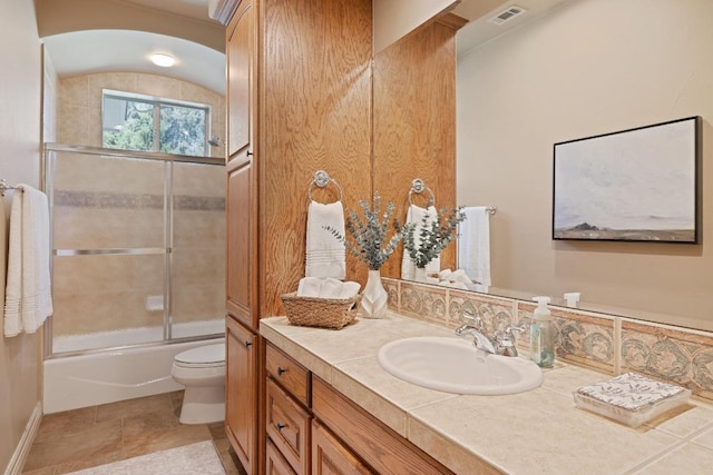 1310 Ventana Cyn, Leander, TX 78641 - full bathroom with vanity, bath / shower combo with glass door, and tile patterned flooring