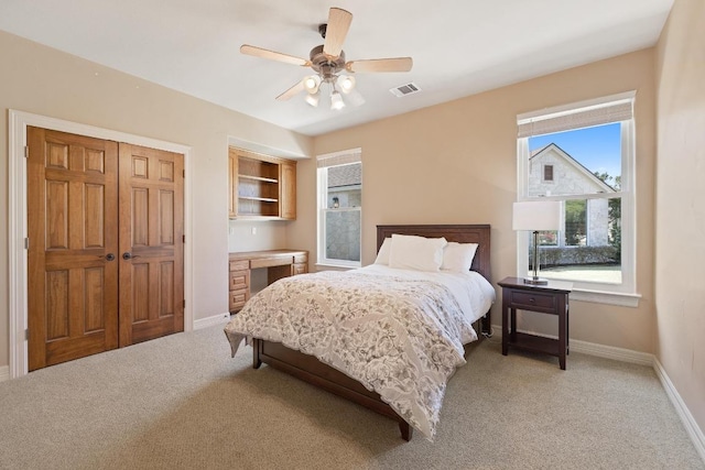 1310 Ventana Cyn, Leander, TX 78641 - bedroom with light carpet, ceiling fan, and a closet