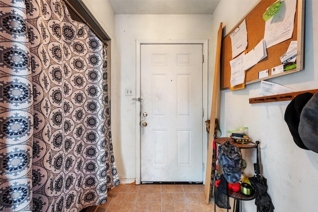 entryway featuring light tile patterned flooring