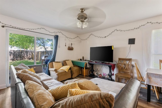 living room with wood finished floors and ceiling fan
