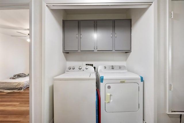 825 Ken St, Austin, TX 78758 - washroom featuring cabinet space, ceiling fan, wood finished floors, and washing machine and clothes dryer