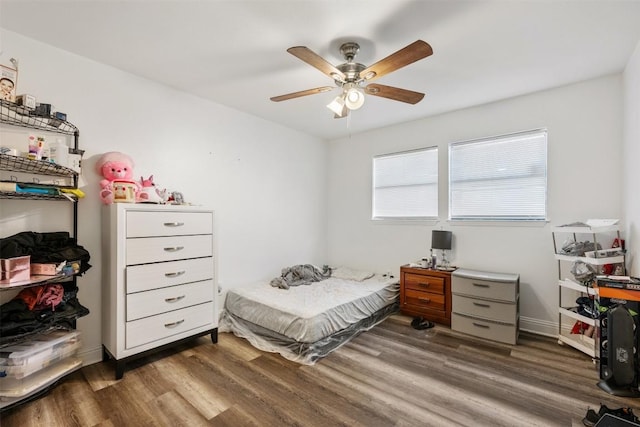 825 Ken St, Austin, TX 78758 - bedroom featuring a ceiling fan and wood finished floors