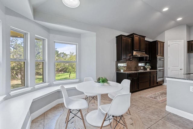 7817 Aria Loop, Austin, TX 78736 - dining area with light tile patterned floors, recessed lighting, lofted ceiling, and baseboards