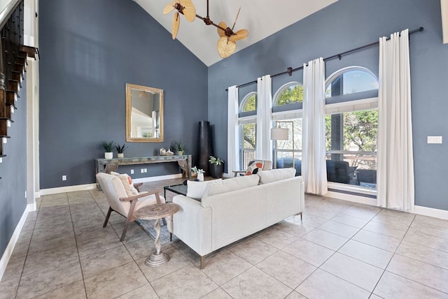 7817 Aria Loop, Austin, TX 78736 - living area with high vaulted ceiling, baseboards, and tile patterned floors