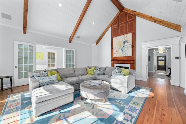 1307 Elton Ln, Austin, TX 78703 - living room with wood finished floors, wooden ceiling, and decorative columns