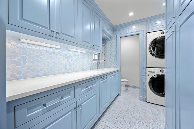 1307 Elton Ln, Austin, TX 78703 - washroom with stacked washer / dryer and light tile patterned floors