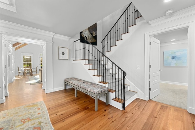 1307 Elton Ln, Austin, TX 78703 - stairs with crown molding, hardwood / wood-style flooring, and recessed lighting