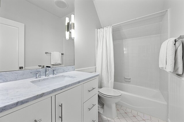 1307 Elton Ln, Austin, TX 78703 - bathroom with vanity, shower / bath combo, tile patterned floors, a wainscoted wall, and vaulted ceiling