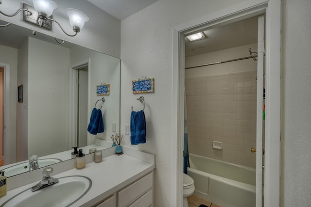 605 Port Unit 3, Horseshoe Bay, TX 78657 - full bathroom featuring vanity, toilet, shower / bathtub combination with curtain, and tile patterned floors
