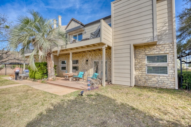 605 Port Unit 3, Horseshoe Bay, TX 78657 - back of property with a balcony and stone siding