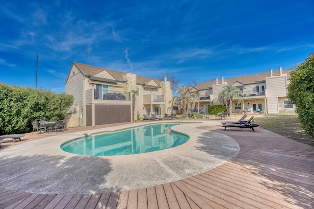 605 Port Unit 3, Horseshoe Bay, TX 78657 - outdoor pool with a patio and a residential view