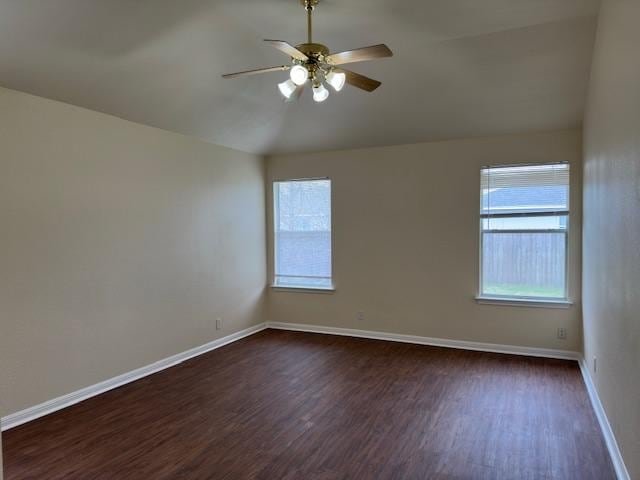 377 Donatello, Kyle, TX 78640 - unfurnished room with a ceiling fan, dark wood finished floors, and lofted ceiling