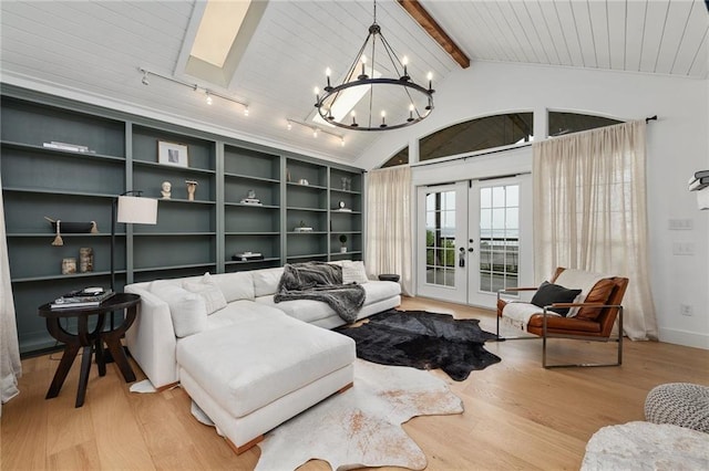 5224 Mccormick Mountain Dr, Austin, TX 78734 - living area featuring wood finished floors, french doors, a chandelier, a skylight, and wooden ceiling