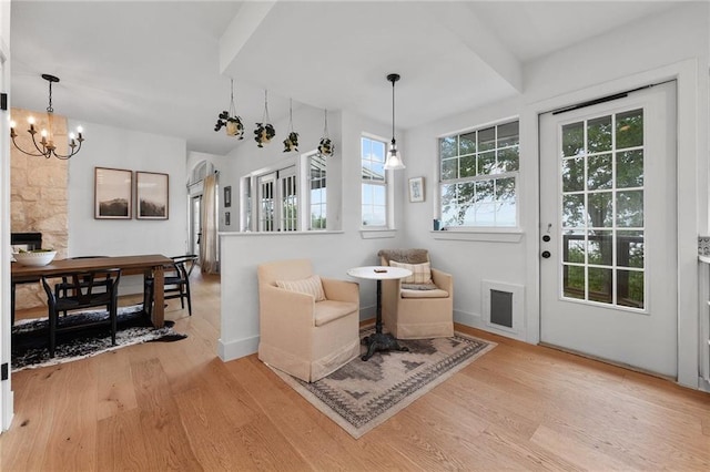 5224 Mccormick Mountain Dr, Austin, TX 78734 - sitting room featuring light wood-type flooring, a chandelier, and baseboards