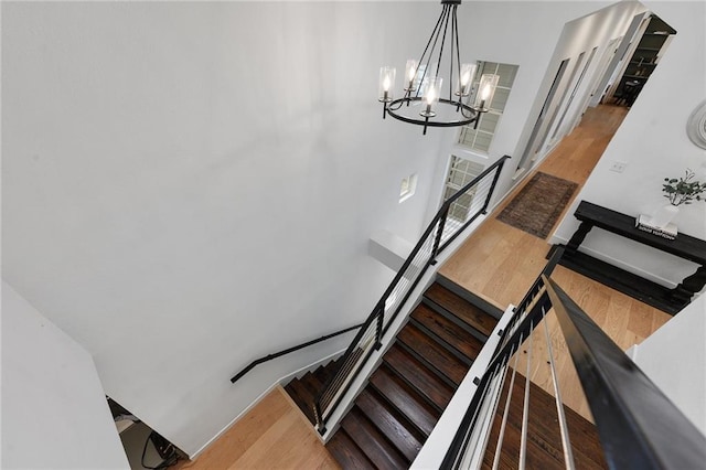 5224 Mccormick Mountain Dr, Austin, TX 78734 - stairs with wood finished floors and a chandelier