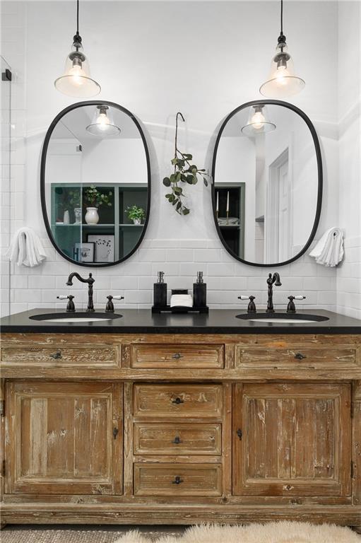 5224 Mccormick Mountain Dr, Austin, TX 78734 - full bathroom with tasteful backsplash and double vanity