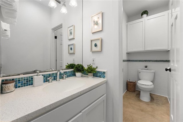 5224 Mccormick Mountain Dr, Austin, TX 78734 - bathroom featuring vanity, toilet, and tile walls