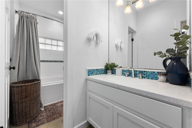 5224 Mccormick Mountain Dr, Austin, TX 78734 - full bathroom featuring vanity, tiled shower / bath combo, tile patterned floors, and decorative backsplash