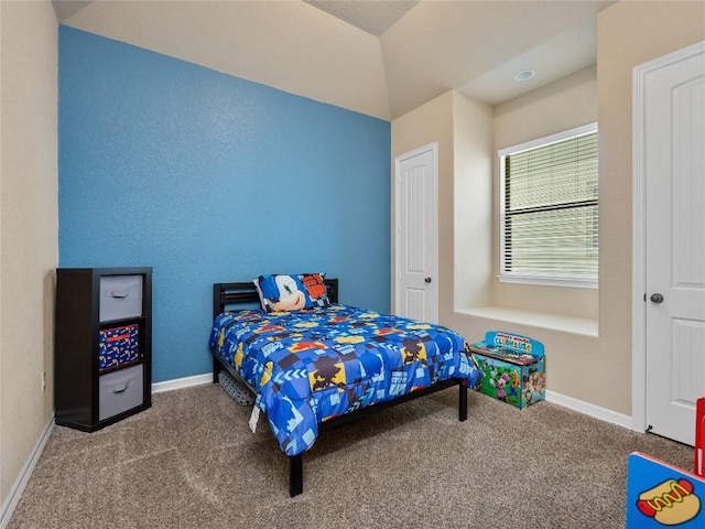 carpeted bedroom featuring baseboards