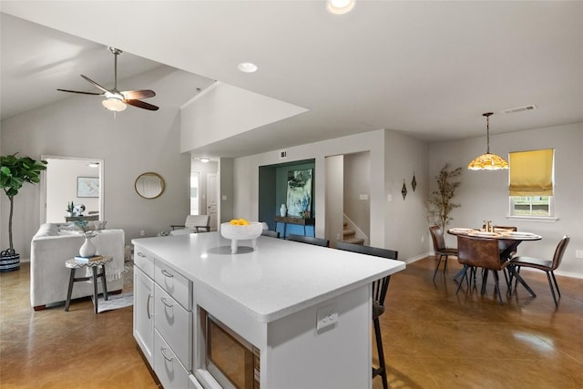 437 Venture Blvd S, Point Venture, TX 78645 - kitchen featuring built in microwave, a center island, a ceiling fan, light countertops, and recessed lighting