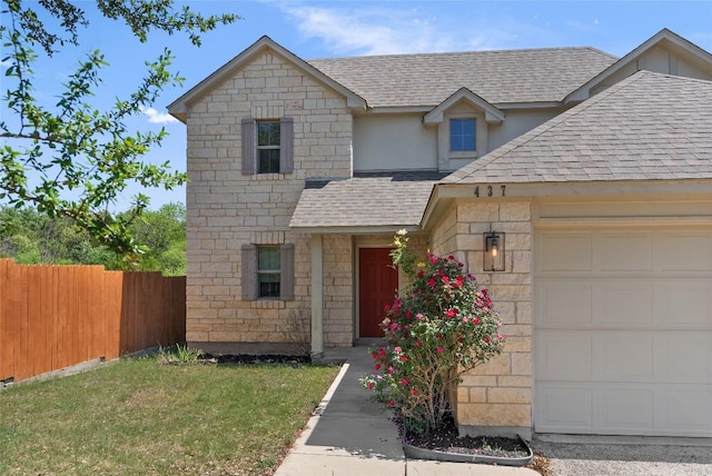 437 Venture Blvd S, Point Venture, TX 78645 - view of front of house with a shingled roof, an attached garage, and stone siding