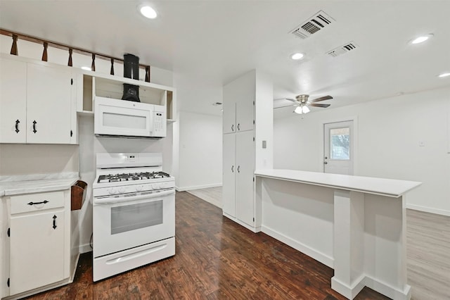 kitchen featuring white appliances, visible vents, light countertops, and ceiling fan
