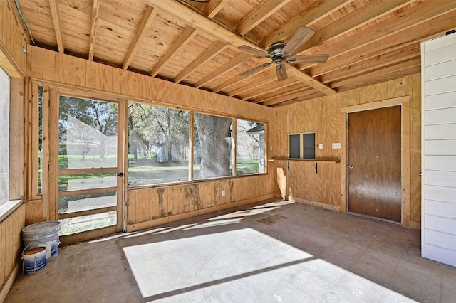 unfurnished sunroom with a ceiling fan