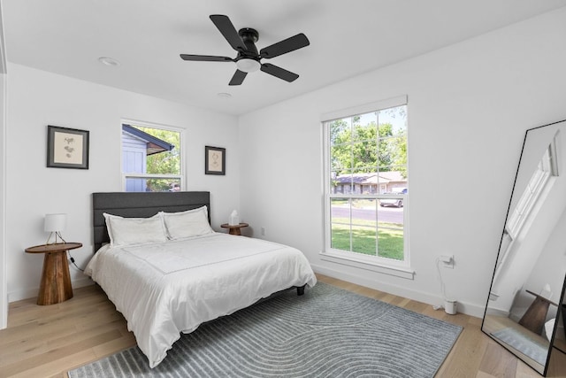 5803 Blythewood Dr, Austin, TX 78745 - bedroom featuring light wood-style floors, ceiling fan, and baseboards