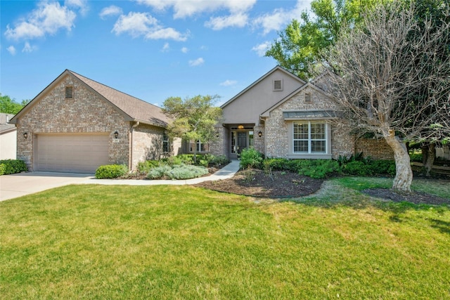 316 Trail Of The Flowers, Georgetown, TX 78633 - view of front facade with a garage, a front yard, driveway, and brick siding