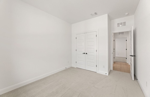 329 Singing Dove Way, Liberty Hill, TX 78642 - unfurnished bedroom featuring light carpet and a closet