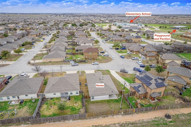birds eye view of property with a residential view