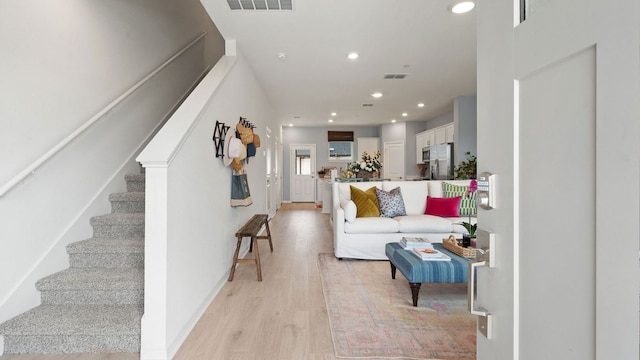 2634 Caleb Asher Loop, Round Rock, TX 78665 - living room with visible vents, stairway, baseboards, light wood finished floors, and recessed lighting