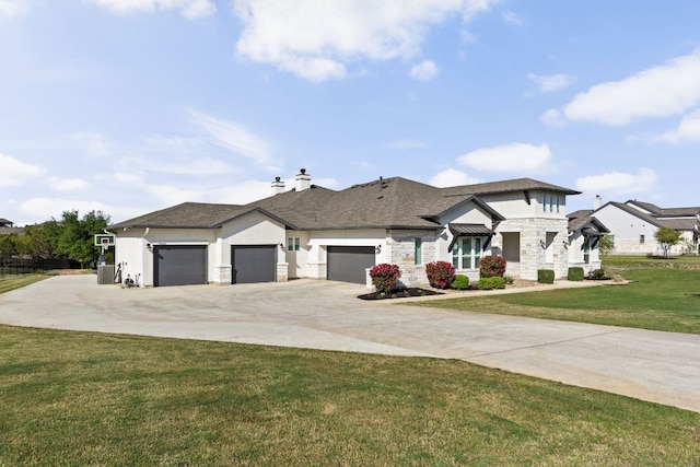 prairie-style home featuring a front yard, stone siding, a garage, a chimney, and driveway