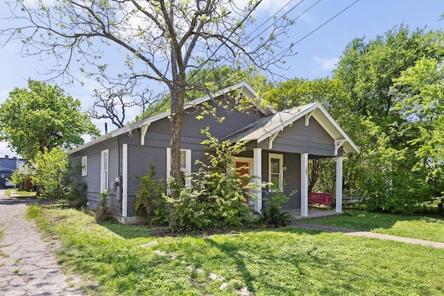 207 W 39th St, Austin, TX 78751 - view of front facade featuring covered porch and a front yard