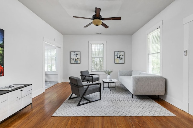 207 W 39th St, Austin, TX 78751 - living area featuring wood-type flooring, healthy amount of natural light, and a ceiling fan