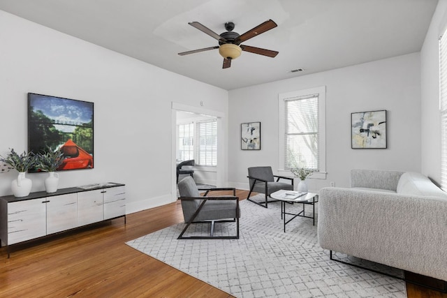 207 W 39th St, Austin, TX 78751 - living room featuring ceiling fan and light wood finished floors