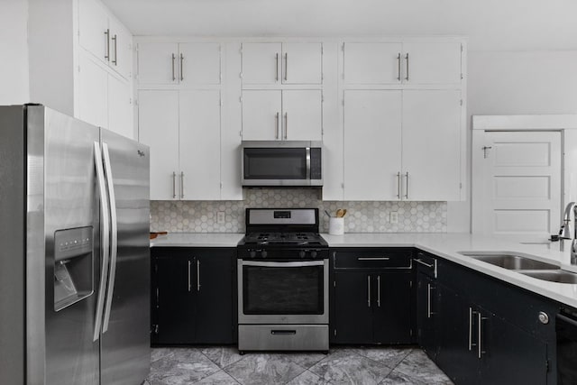 207 W 39th St, Austin, TX 78751 - kitchen featuring appliances with stainless steel finishes, light countertops, and white cabinets