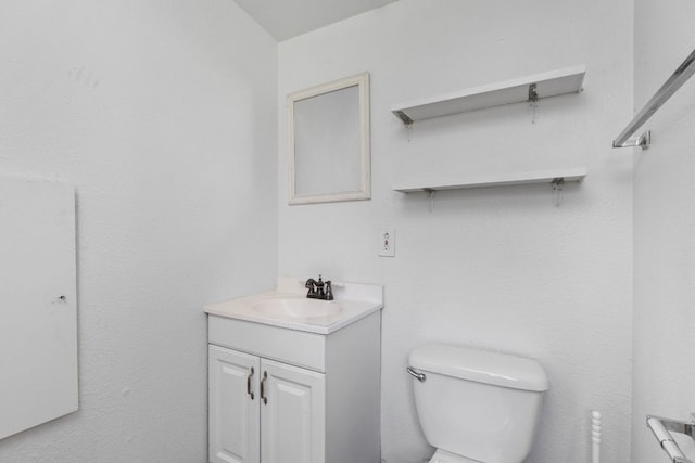 207 W 39th St, Austin, TX 78751 - half bathroom featuring vanity and toilet