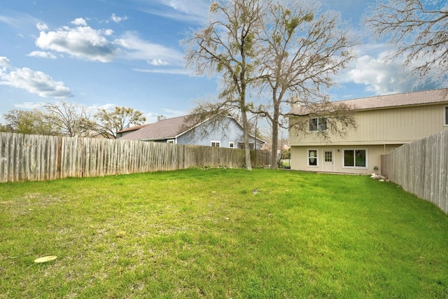 view of yard with a fenced backyard
