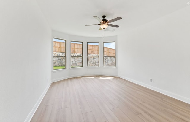 129 Elm View Dr, Georgetown, TX 78628 - unfurnished room featuring light wood-style flooring, baseboards, and a ceiling fan