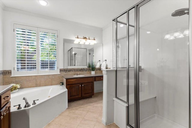 5909 Sunset Rdg, Austin, TX 78735 - bathroom featuring vanity, a shower stall, crown molding, a garden tub, and tile patterned floors
