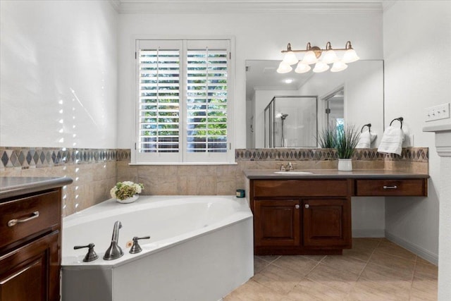 5909 Sunset Rdg, Austin, TX 78735 - bathroom with crown molding, vanity, a bath, a shower stall, and tile patterned flooring