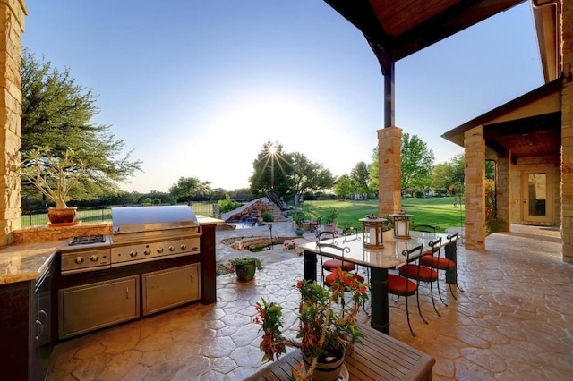 1298 Mystic Pkwy, Spring Branch, TX 78070 - patio terrace at dusk featuring outdoor dining space, area for grilling, and a patio