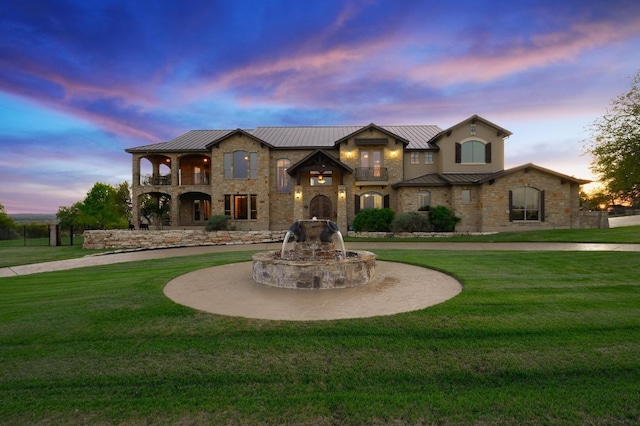1298 Mystic Pkwy, Spring Branch, TX 78070 - view of front facade with a standing seam roof, a balcony, a front yard, and curved driveway